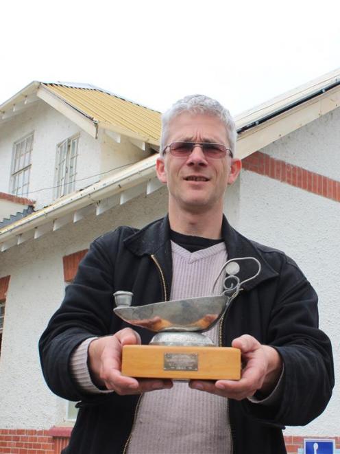 Museum curator Gary Ross outside the former Balclutha Hospital with the Nightingale Lamp,  which...