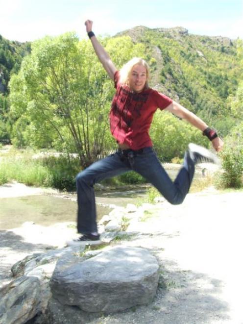Musician Marty Casey, of the US, takes time out in Arrowtown yesterday afternoon. Photo by Tracey...