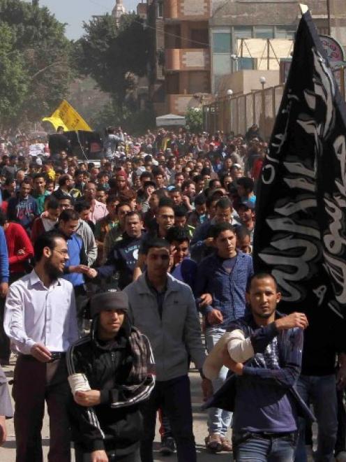 Muslim Brotherhood supporters shout slogans during a recent protest in Matarya area, east of...