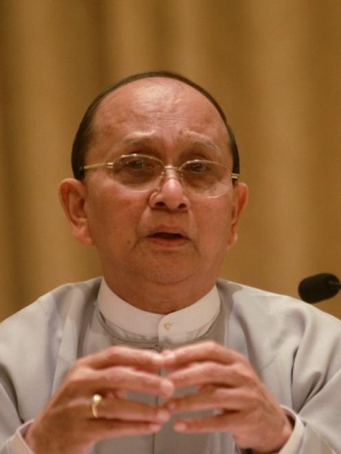 Myanmar's President Thein Sein talks during his first news conference since his re-appointment as...