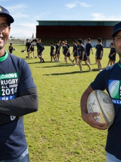 Nanda Majhi (left) and Tiger Ahmed get a taste of rugby Auckland-style.