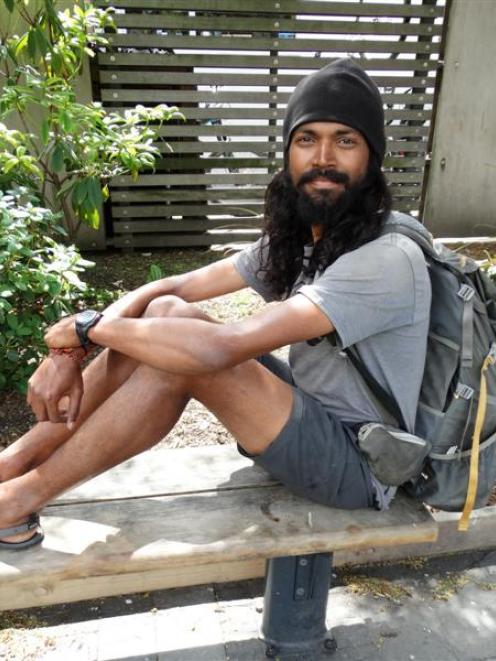 Naresh Kumar takes a break  in Queenstown yesterday on his journey the length of New Zealand....