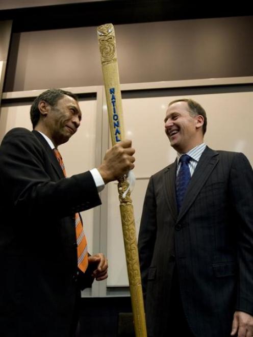 National leader John Key is presented a taiaha from the chairman of Te Wananga o Aotearoa,...