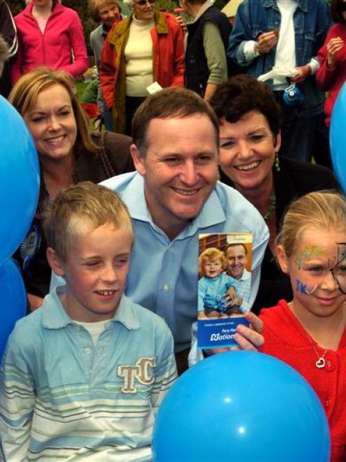 National Party leader John Key enjoys a campaign photo opportunity in Nelson. Photo by NZPA.