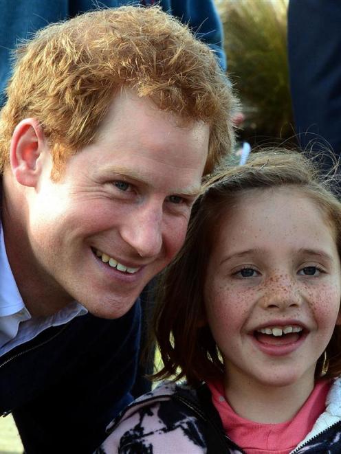 Neave Cameron (7), of Queenstown gets Prince Harry to pose for a photograph at the Stewart Island...