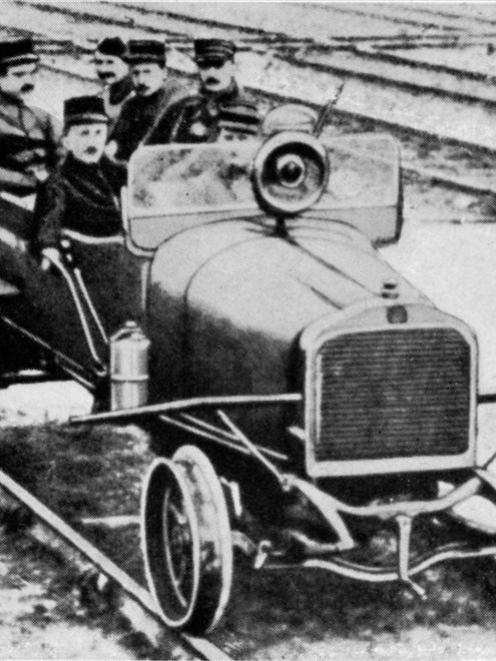 Necessity is the mother of invention. A motor car in the war area in Northern France adapted for...