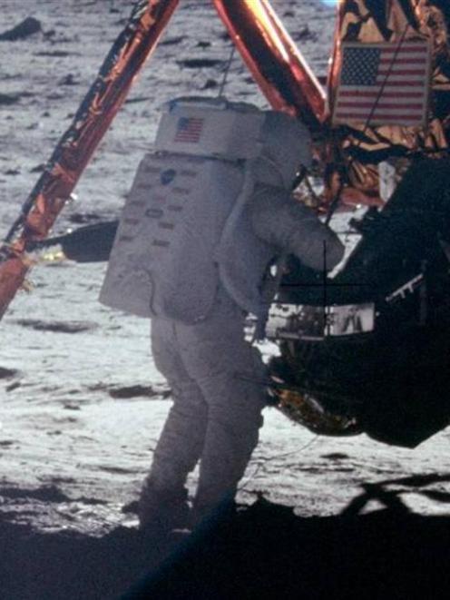 Neil Armstrong works at the LM in the only photo taken of him on the moon from the surface. Photo...