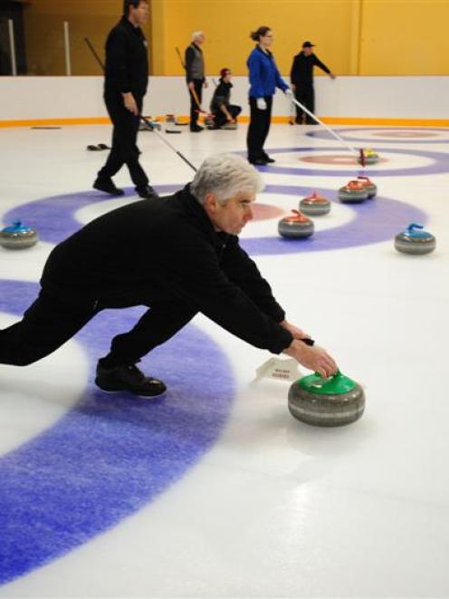 Nelson Ede, of the Maniototo senior (over-50) team, delivers a stone during the New Zealand...