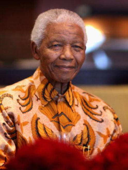Nelson Mandela attends a lunch to benefit the Mandela Children's Foundation in Cape Town in this...