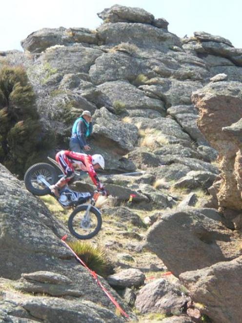 Nelson trials rider Nick Oliver (19), negotiates his way down a steep rocky face at Earnscleugh...
