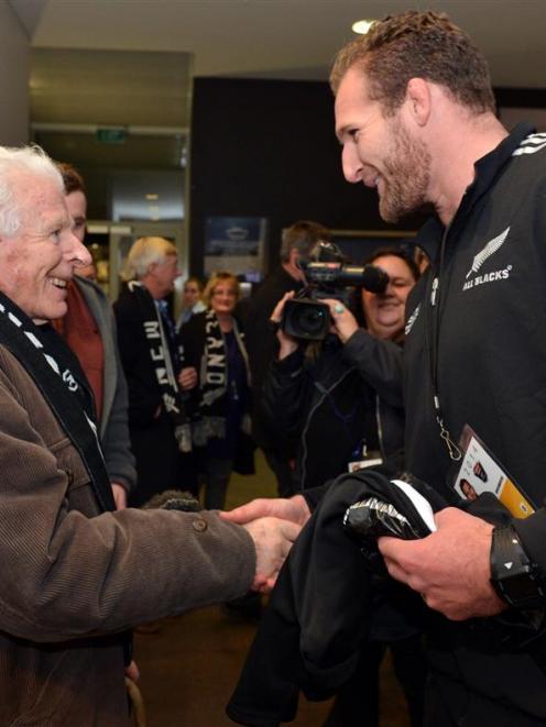 Neville Selwood is presented with  an All Blacks jersey by Kieran Read  at Forsyth Barr Stadium...