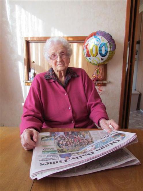 New centenarian May Watson enjoys her morning Otago Daily Times at her Oamaru home. Photo by...