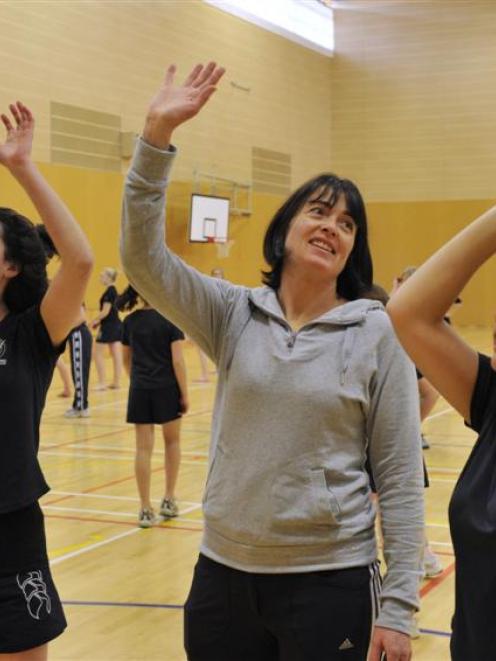 New Steel co-coach Janine Southby passes on a few tips to Columba College pupils Georgia Nichol ...