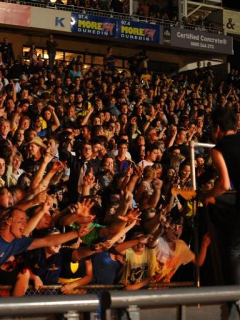 New Zealand band Shihad entertains a packed terrace at Carisbrook on Saturday night. Photo by...