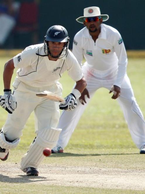 New Zealand captain Ross Taylor watches his shot as he runs between wickets during the second...
