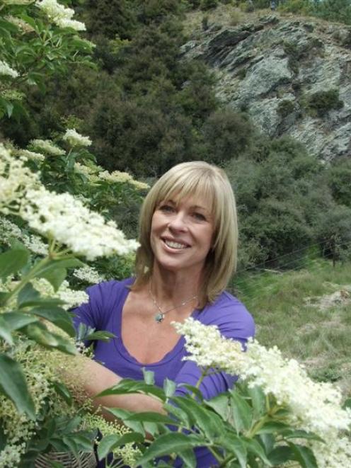 New Zealand cook and food writer Annabel Langbein picks elderflowers on a Wanaka roadside during...