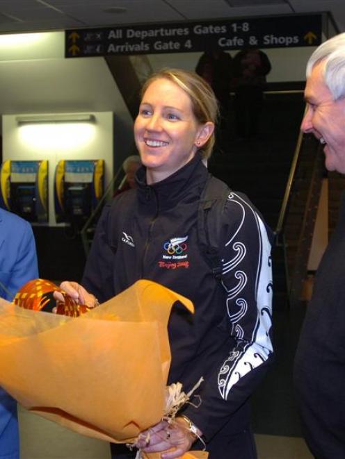 New Zealand Olympic track cyclist Alison Shanks is greeted at Dunedin International Airport...