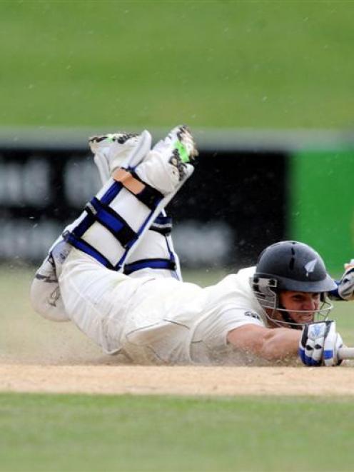New Zealand opener BJ Watling makes his ground on his way to 60 not out. Photo from NZPA.