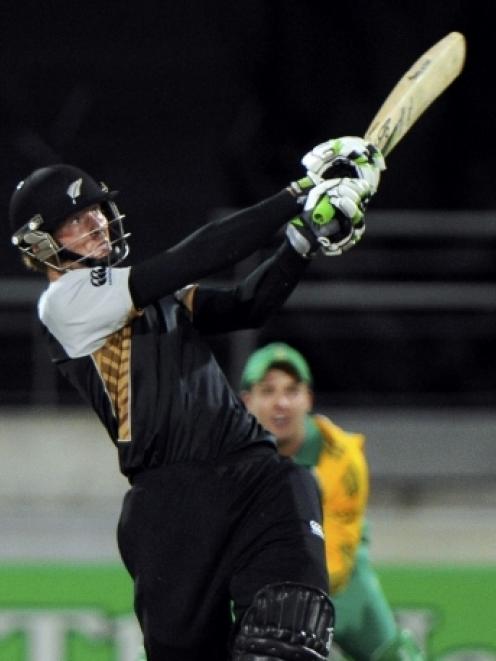 New Zealand opener Martin Guptill hits a six against South Africa in the first game of their...