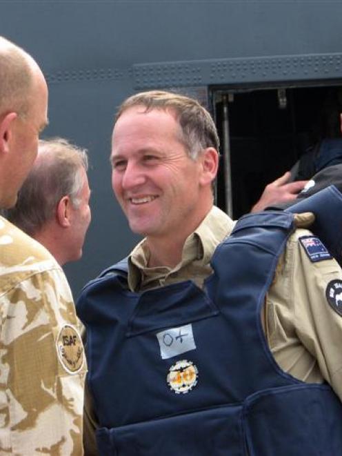 New Zealand Prime Minister John Key arrives to visit troops, Kabul, Afghanistan, earlier this month.