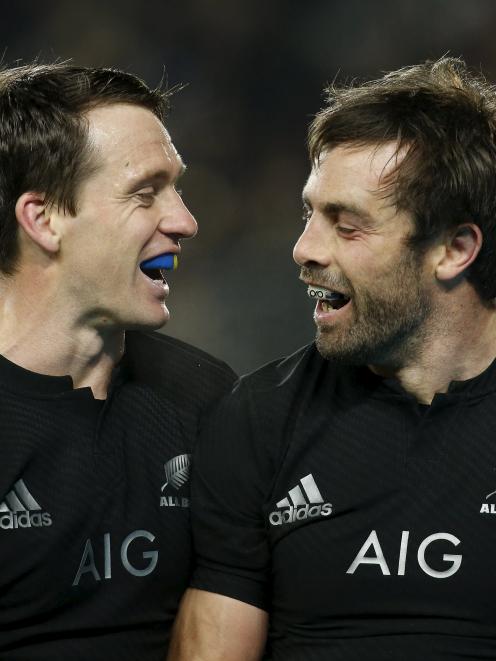 All Black centre Conrad Smith (R) celebrates his try with Ben Smith. Photo by Reuters.