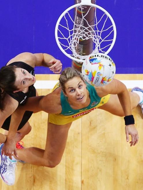 New Zealand's Bailey Mes (L) and Australia's Julie Corletto in action during their World Cup...