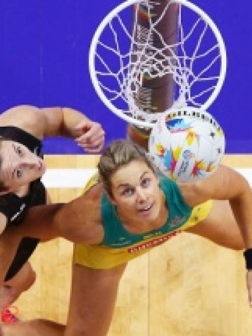 New Zealand's Bailey Mes (L) and Australia's Julie Corletto in action during their World Cup...