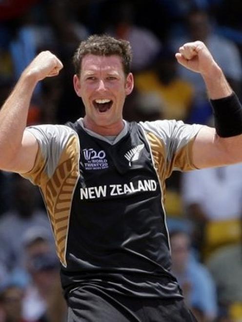 New Zealand's bowler Ian Butler celebrates the dismissal of Pakistan's captain Shahid Afridi. (AP...
