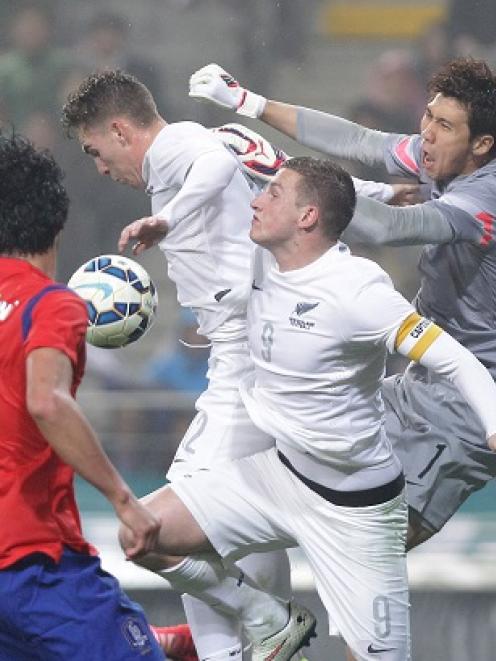 New Zealand's Chris Wood tries to outjump the South Korean defence. Photo by Getty