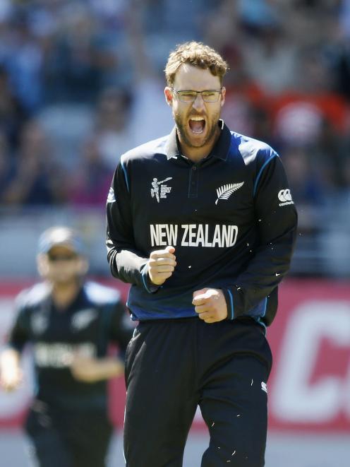 New Zealand's Daniel Vettori celebrates dismissing Australia's Steven Smith during their Cricket...