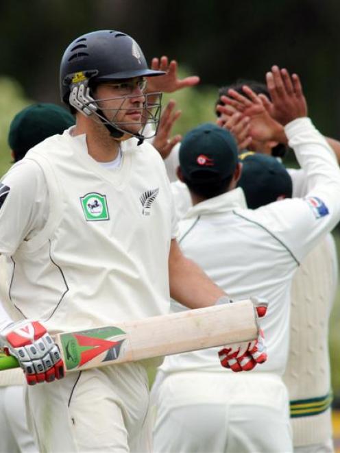 New Zealand's Daniel Vettori is out for 8 as Pakistan celebrate. Credit:NZPA / Ross Setford.