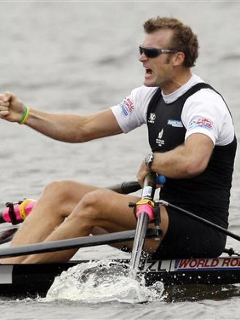 New Zealand's Mahe Drysdale celebrates after winning the Men's Single Sculls final in Poznan,...
