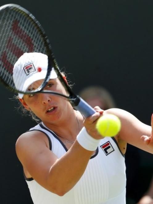 New Zealand's Marina Erakovic hits a return to Britain's Laura Robson during their women's...