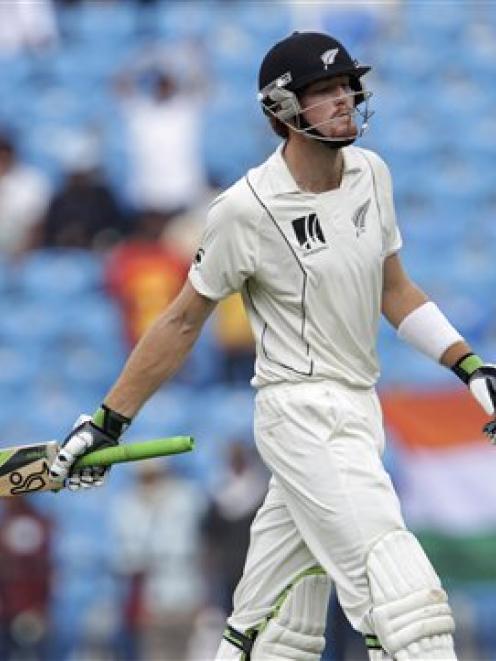 New Zealand's Martin Guptill reacts as he leaves the ground after being dismissed by India's S....