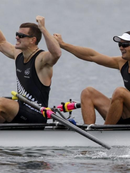 New Zealand's Nathan Cohen and Joseph Sullivan celebrate after winning the men's double sculls...