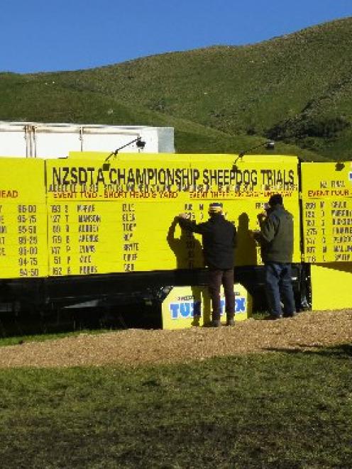 New Zealand Sheep Dog Trial Association volunteers update the leader board on the final day of...