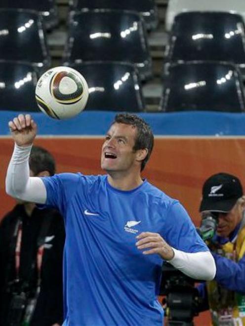 New Zealand soccer team captain Ryan Nelsen controls the ball during a training session at...