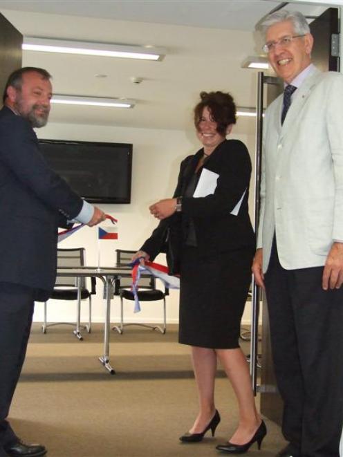 Newly appointed honorary consul of the Czech Republic Vladka Kennett (centre) cuts the ribbon to...