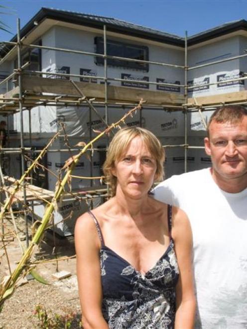 Nicky and Chris Wordsworth in front of the new house they are having built on their Torbay section.