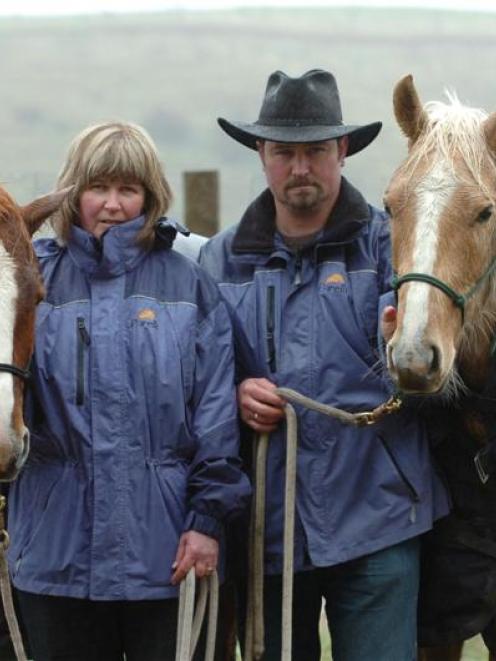 Nicky and Neil Rutherford with Solo (left) and River (right) yesterday. Another of their horses,...