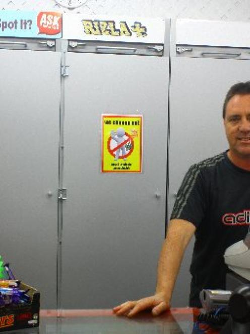 No way . . . Monte Carlo Milk Bar owner Mike Casey has put up a sign telling people the store...