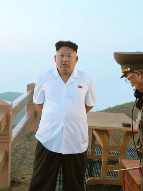 North Korean leader Kim Jong Un guides a tactical rocket firing drill of the KPA Strategic Force....