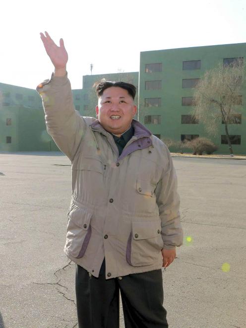 North Korean leader Kim Jong Un has a photo session with participants in the second meeting of...