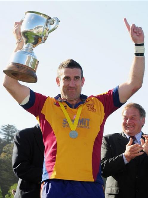 North Otago captain Luke Herden holds the Meads Cup aloft after his team beat Wanganui in the...