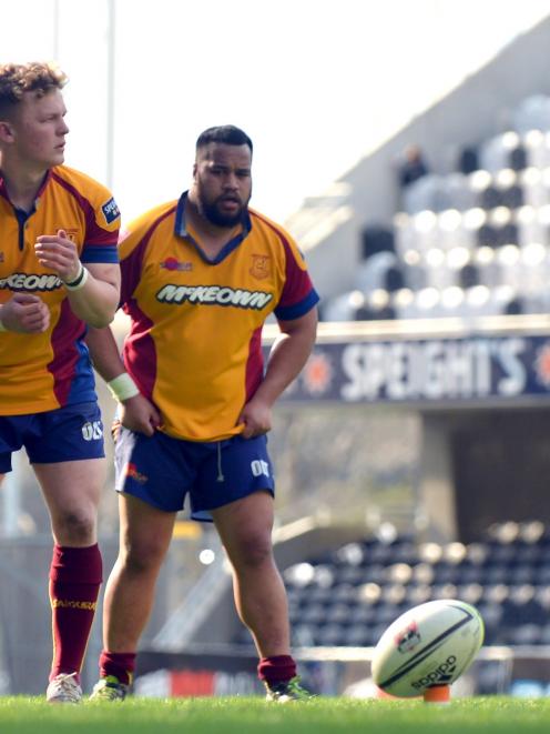 North Otago first five-eighth Ben Palmer lines up a penalty next to team-mate Kilioni Taufa...