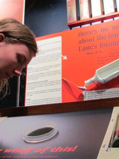 North Otago Museum Curator Chloe Searle samples  Lane's Emulsion. Photo by Andrew Ashton.