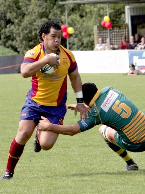 North Otago No 8 Tevita Fifita charges past Mid Canterbury lock Dan Dwyer during the Meads Cup...