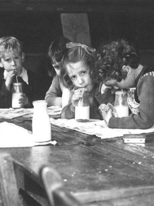 Northeast Valley School pupils drink their milk in the 1950s. Photo by Evening Star.