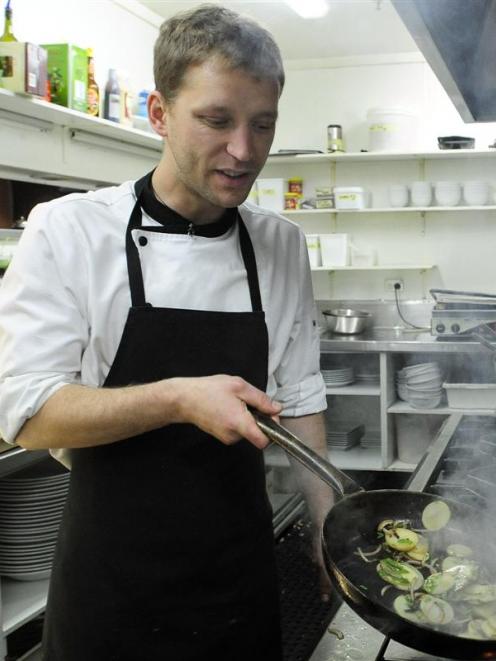 Nova Cafe chef Michal Roth frying potatoes. Photo by Craig Baxter.