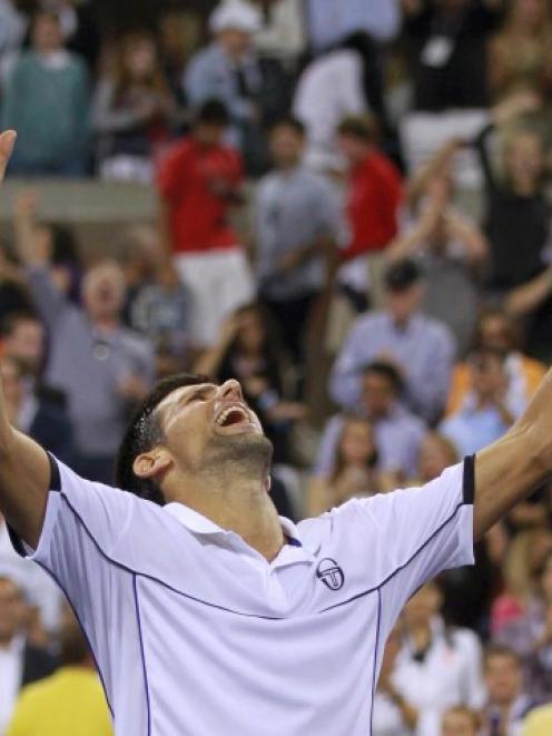 Novak Djokovic of Serbia celebrates after defeating Rafael Nadal of Spain in the men's final of...